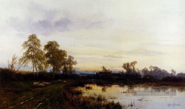 Étangs lacs et chutes d’eau œuvres - Coucher de soleil sur un paysage de ferme Alfred de Breanski Snr